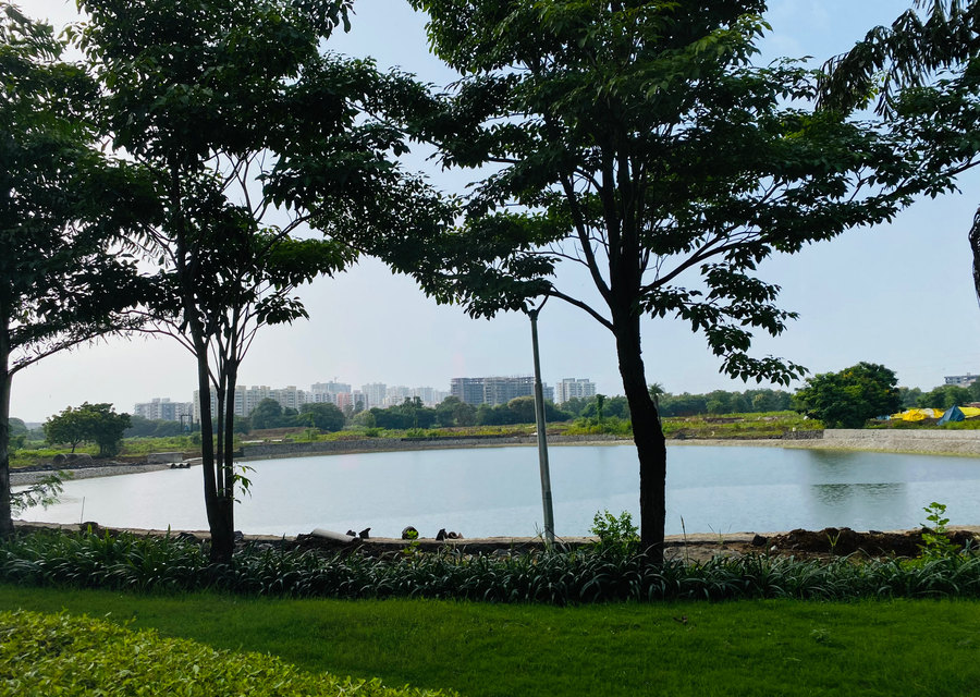 Lake — through the trees at Ensaara Metropark, Nagpur